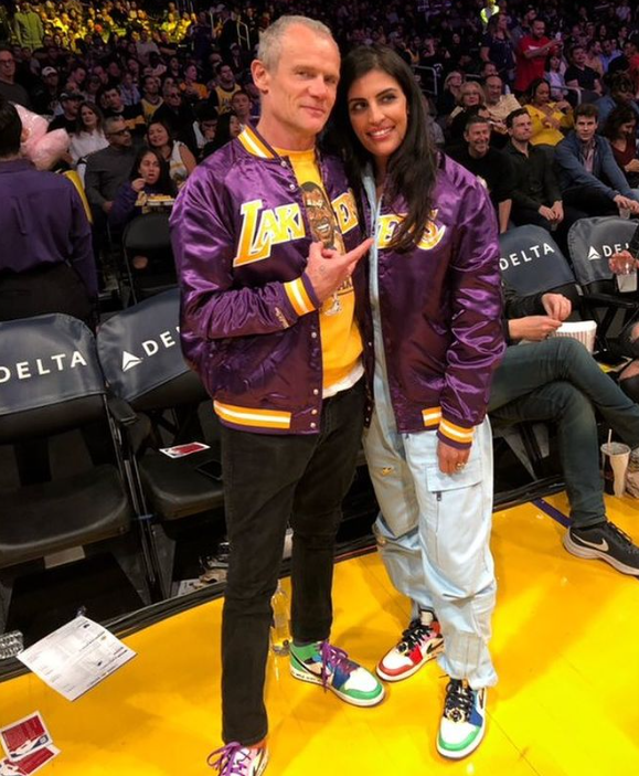 Flea at an NBA game of Lakers wearing sneakers